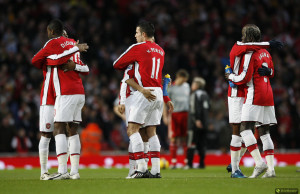Arsenal's players embrace before kick-off